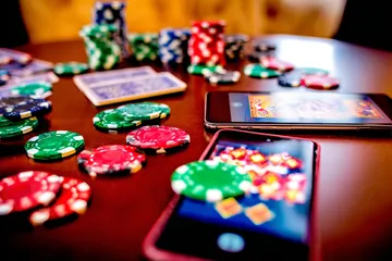 CROWNBD App — Fast, responsive, and optimized for all devices A cheerful woman in traditional clothing using her smartphone during a festive moment, showing how easily the CROWNBD app fits into everyday life.