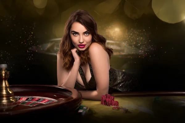 A glamorous woman holding casino chips in a neon-lit environment, representing the premium online casino atmosphere of CROWNBD.