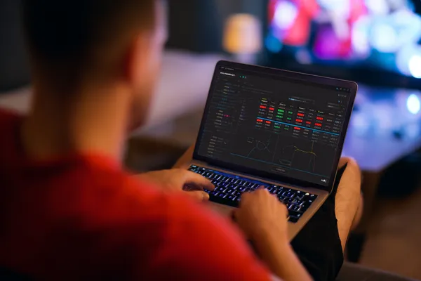 A close-up shot of golden coins falling around a spinning roulette wheel, representing immersive casino action at CROWNBD.