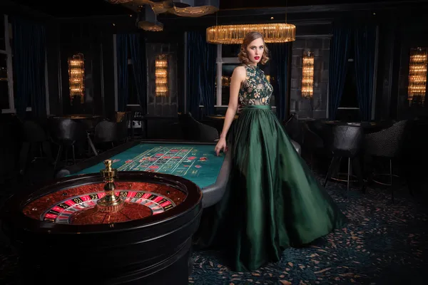 A player using their smartphone during a festive local event, representing CROWNBD’s fully mobile-friendly casino.